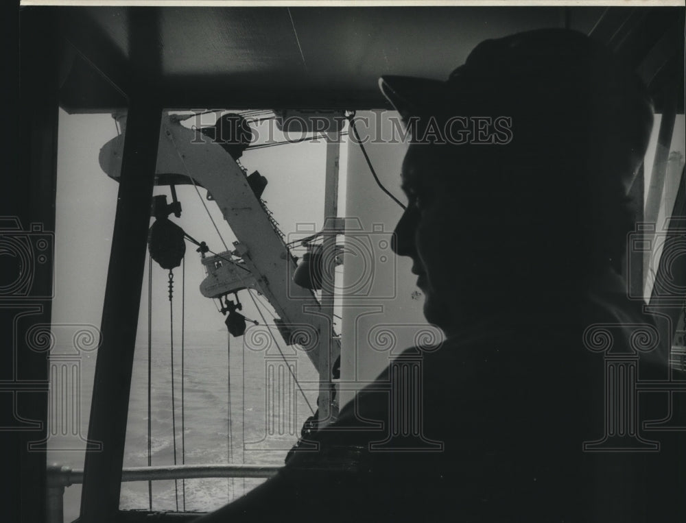 1974 Press Photo Man Looks Out Window of Ship - nob02461