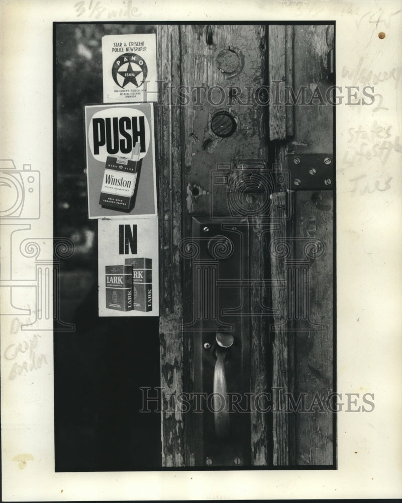 1977 Press Photo Old Wooden Store Door with Cigarette Advertisements- Historic Images