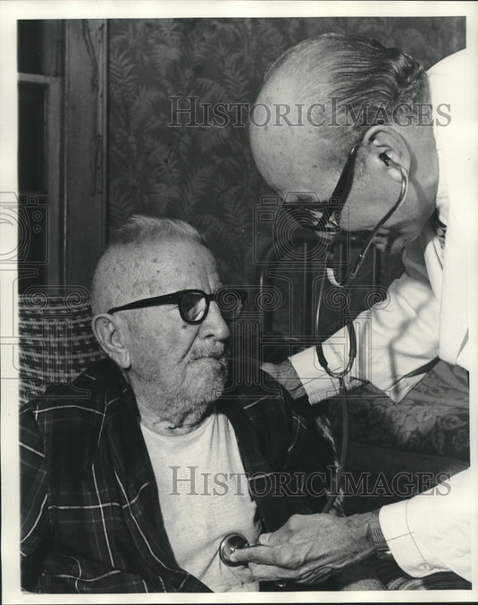 1974 Press Photo Older Man gets his Heart Checked with Doctor and Stethoscope- Historic Images