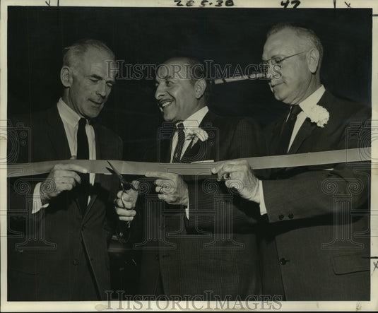 1961 Press Photo Louis Fernandez & others cut ribbon for import auto dealership