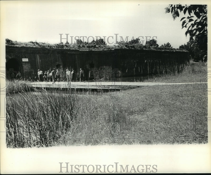 Load image into Gallery viewer, 1961 Press Photo Visitors explore and walk grounds of historic fort.
