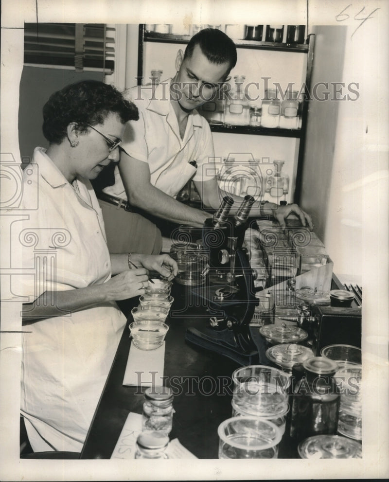 Load image into Gallery viewer, 1955 Press Photo Mrs. Harold Gagnet, Lloyd Burkenstock at the eye bank
