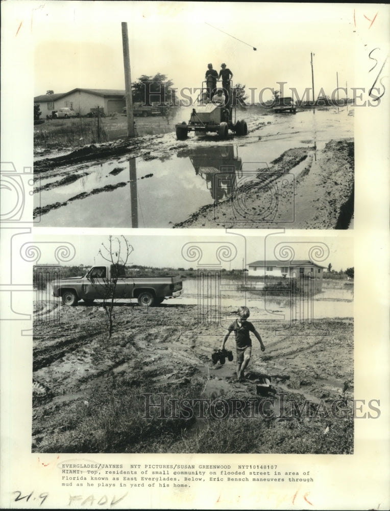 1981 Press Photo Family drives through mud &amp; Eric Bensch plays, East Everglades- Historic Images