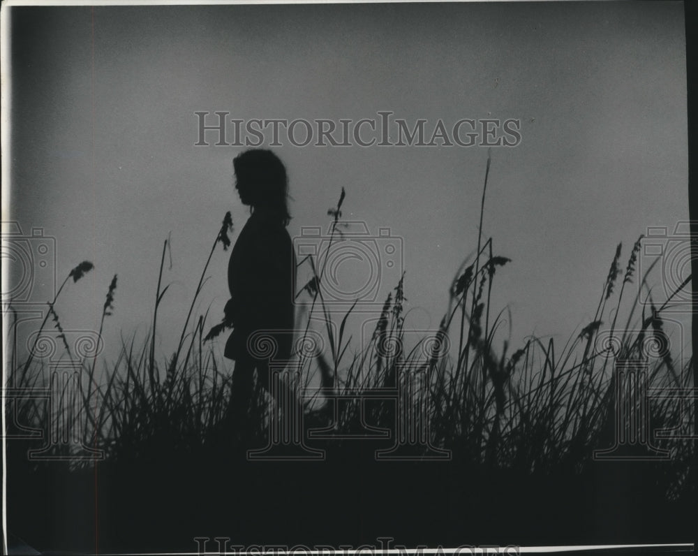 1975 Press Photo Child walks among reeds on Sand Hill outside old Fort Morgan.- Historic Images