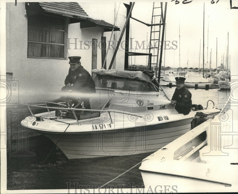 Load image into Gallery viewer, 1971 Press Photo Two firemen aboard a fireboat in Municipal Yacht Harbor.

