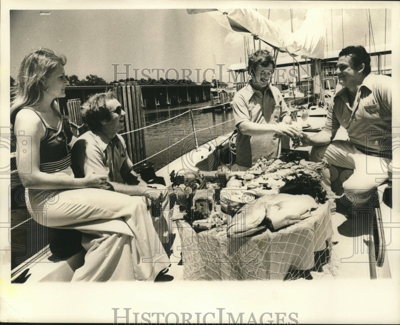 Load image into Gallery viewer, 1973 Press Photo Food sampling aboard a yacht. - nob12757
