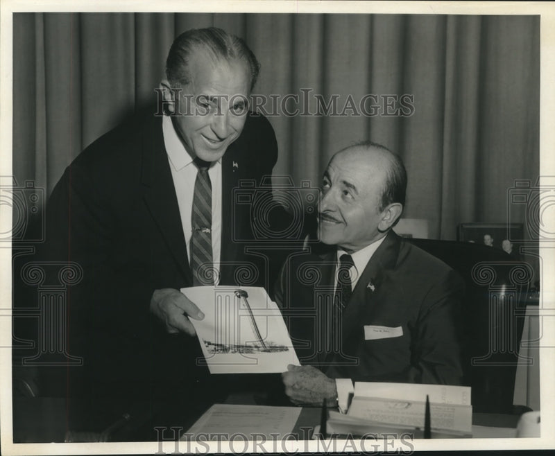 Load image into Gallery viewer, 1968 Press Photo Mayor Schiro and Dr. Charles Foti admire a photo of the tower.
