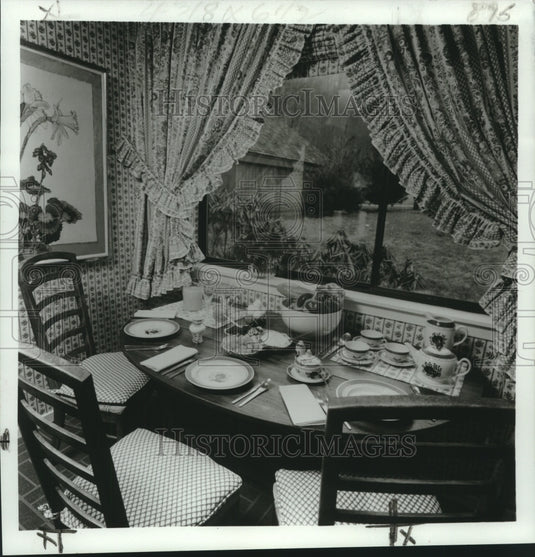 1971 Press Photo Breakfast area with checked padded chairs and flower painting