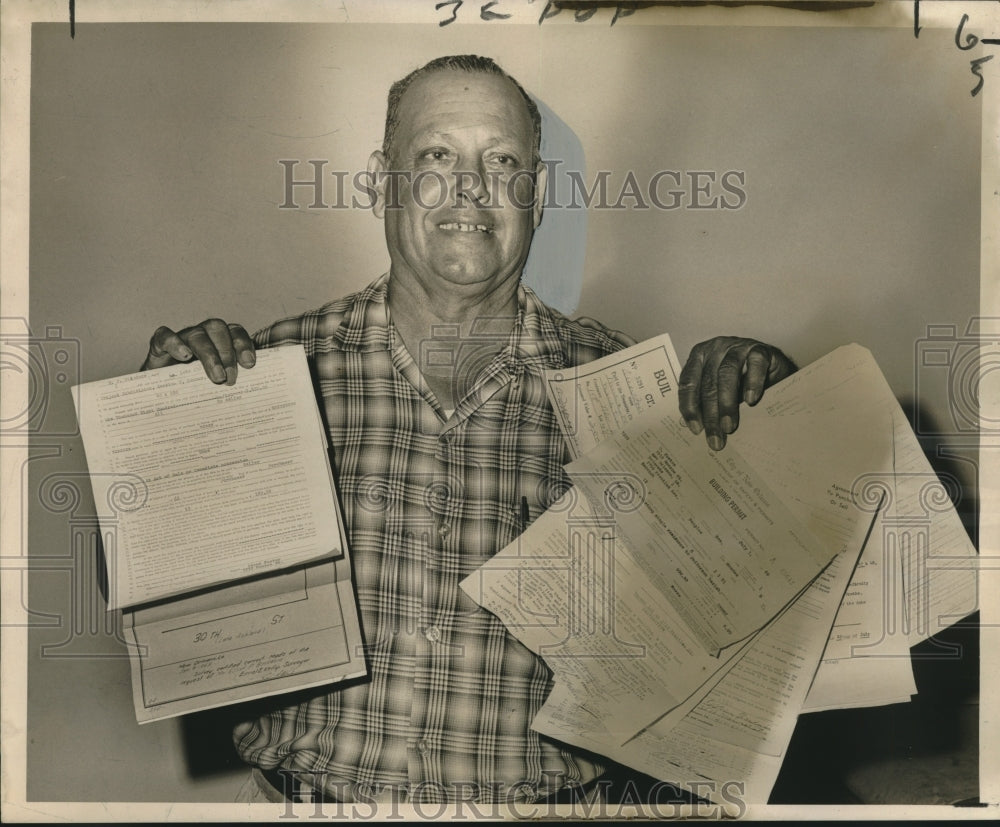 1966 Press Photo Prentiss Avenue home owner Oscar Foster displays permits