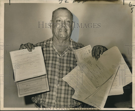 1966 Press Photo Prentiss Avenue home owner Oscar Foster displays permits