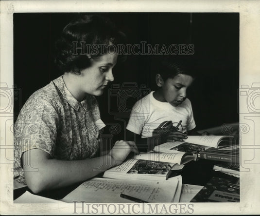 1964 Press Photo Polly Nicholas listens as Adam Gaytan reads - nob16780