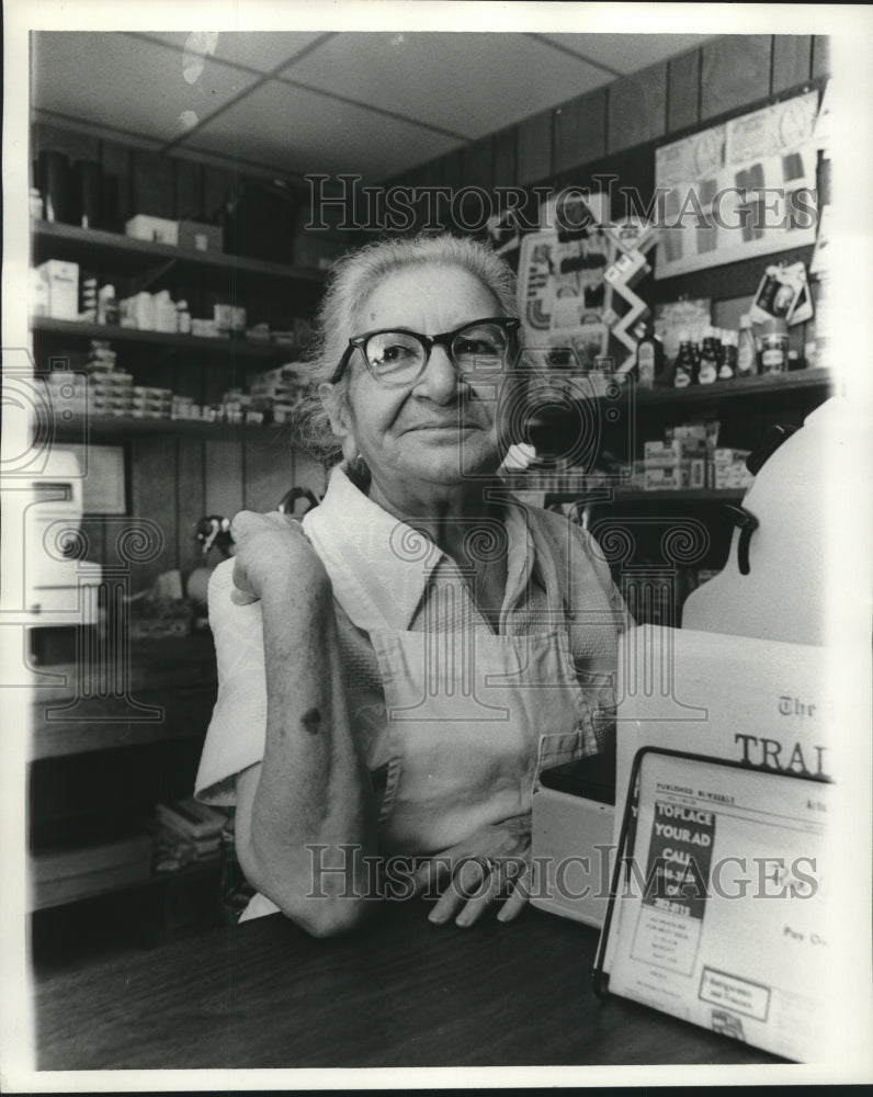 1976 Press Photo Mrs. Joseph Fulco behind a store counter- Historic Images