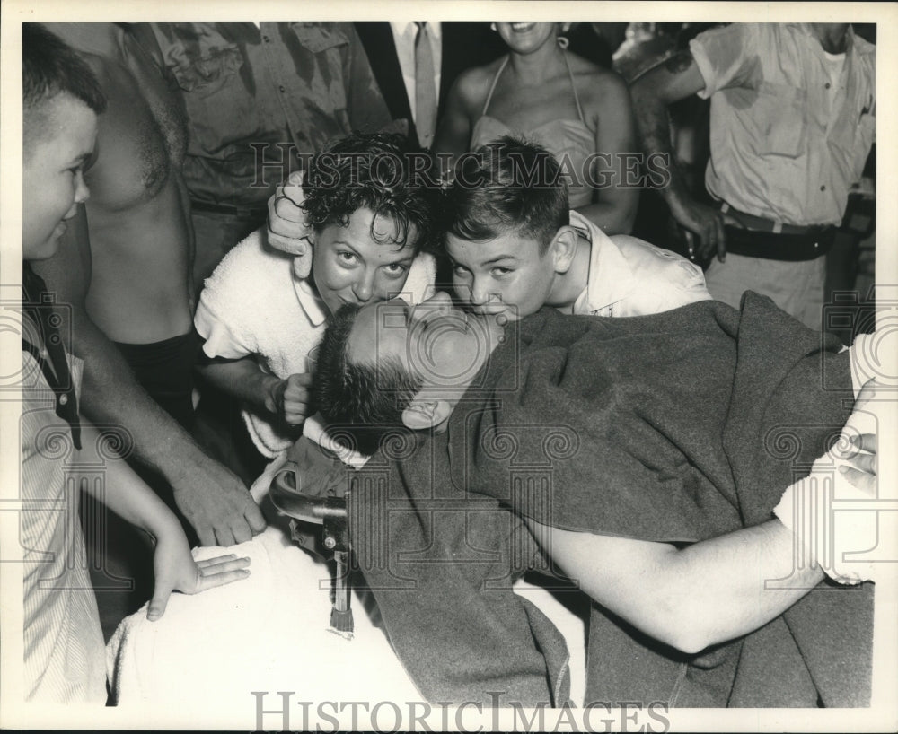 1958 Press Photo On stretcher following exit from water - nob18013