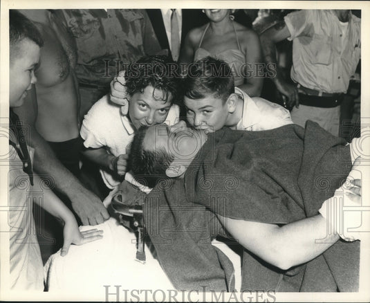 1958 Press Photo On stretcher following exit from water - nob18013