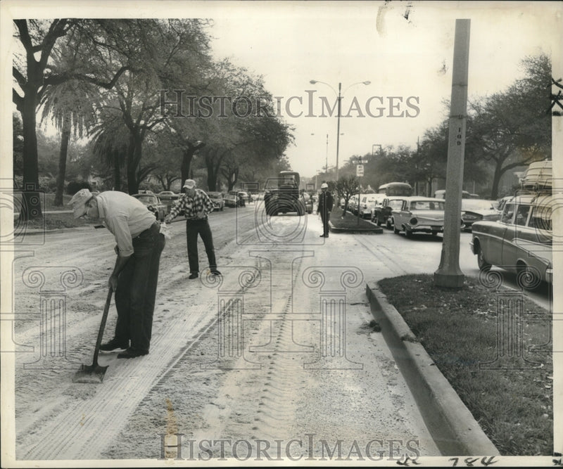 Load image into Gallery viewer, 1960 Press Photo City works spread sand over spilled grease on roadway, Gentilly
