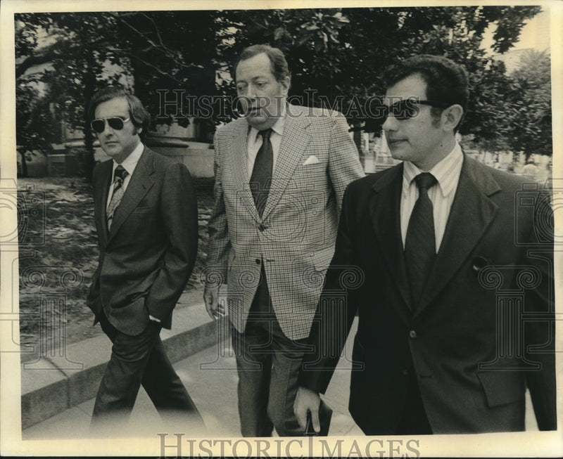 Load image into Gallery viewer, 1973 Press Photo Jim Garrison and his attorneys leave court at noon break
