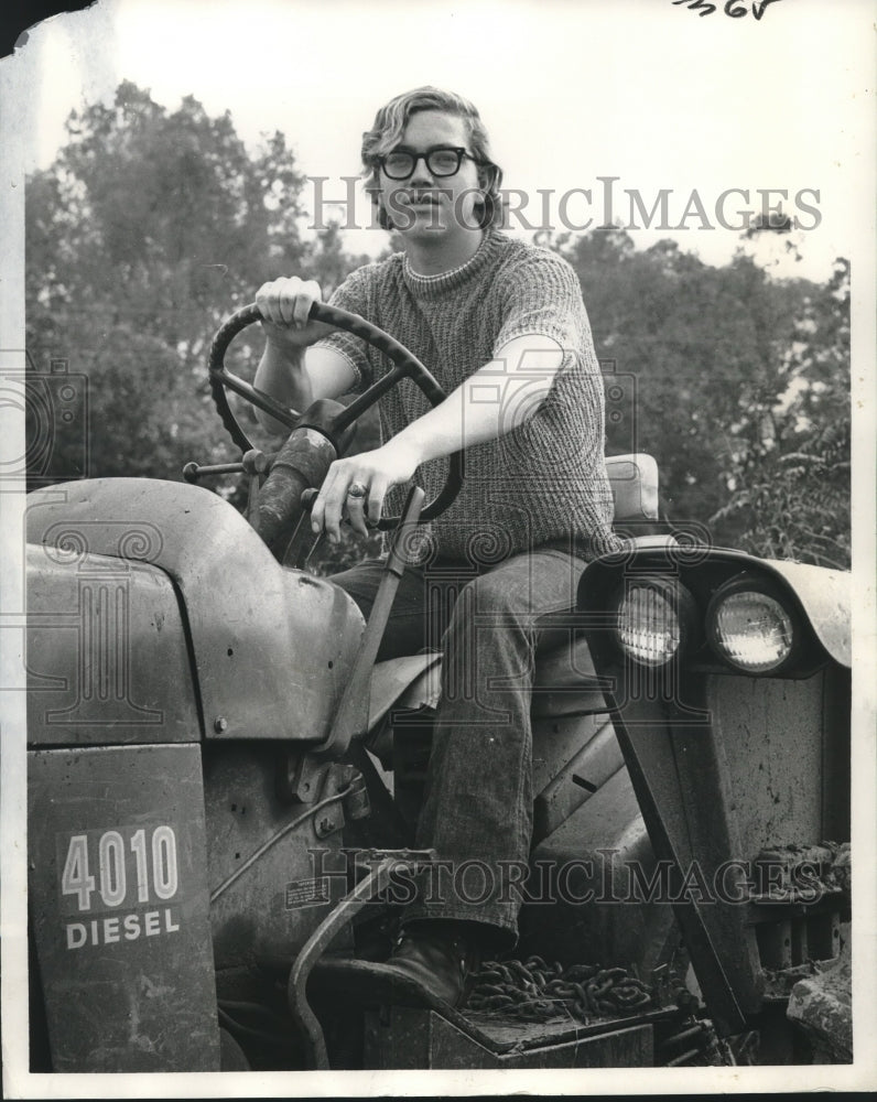 Load image into Gallery viewer, 1971 Press Photo Michael Murphy shows off his prowess as a farm tractor operator
