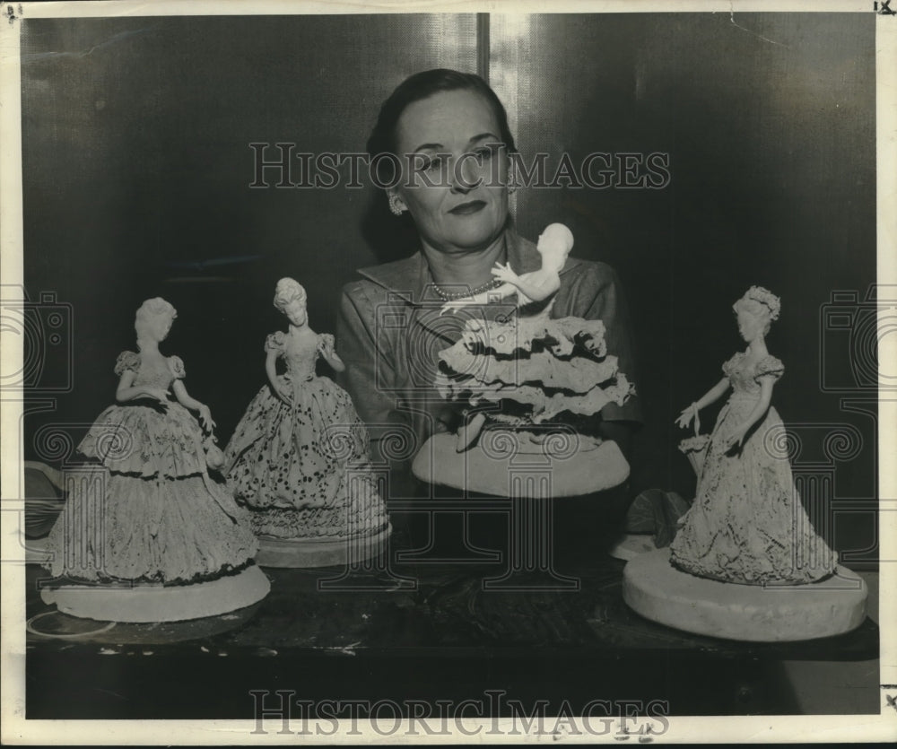1953 Press Photo Bonnie Fleischmann holds up one of her figurines, a ballerina