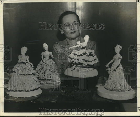 1953 Press Photo Bonnie Fleischmann holds up one of her figurines, a ballerina