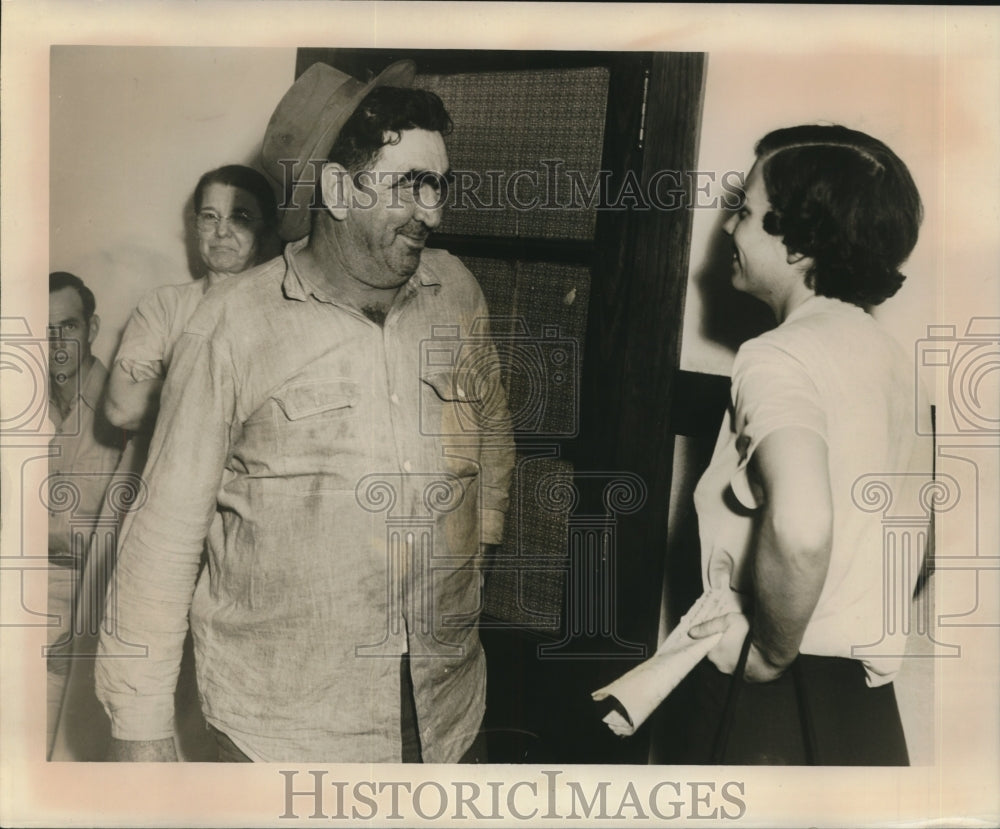 1950 Press Photo Albert Gonzales joking around with a woman - nob20876