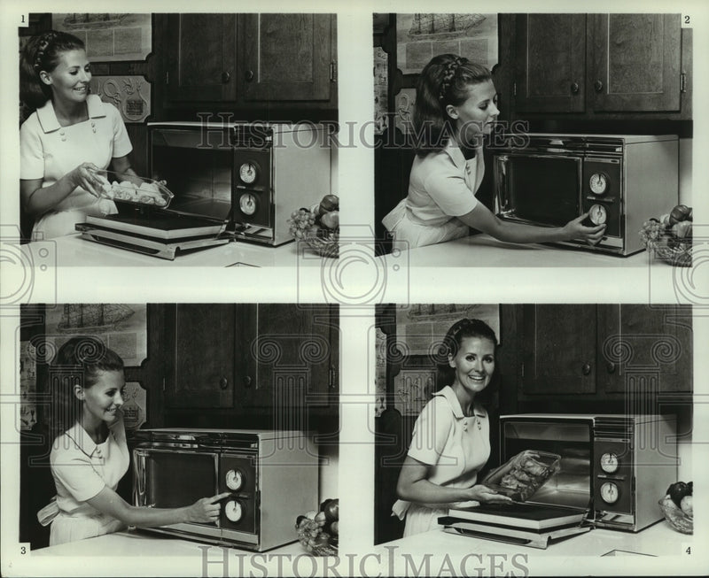 Load image into Gallery viewer, 1973 Press Photo A model demonstrates the new Radarange microwave oven by Amana

