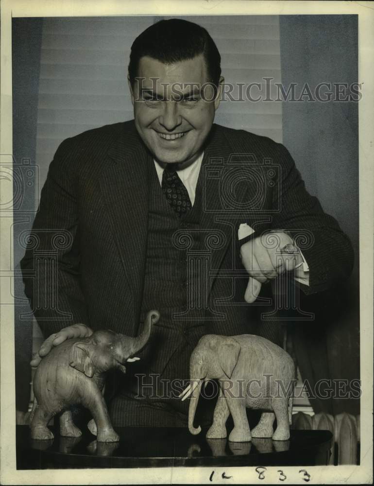 Load image into Gallery viewer, 1954 Press Photo Governor Hoffman of New Jersey pets elephant with trunk up.
