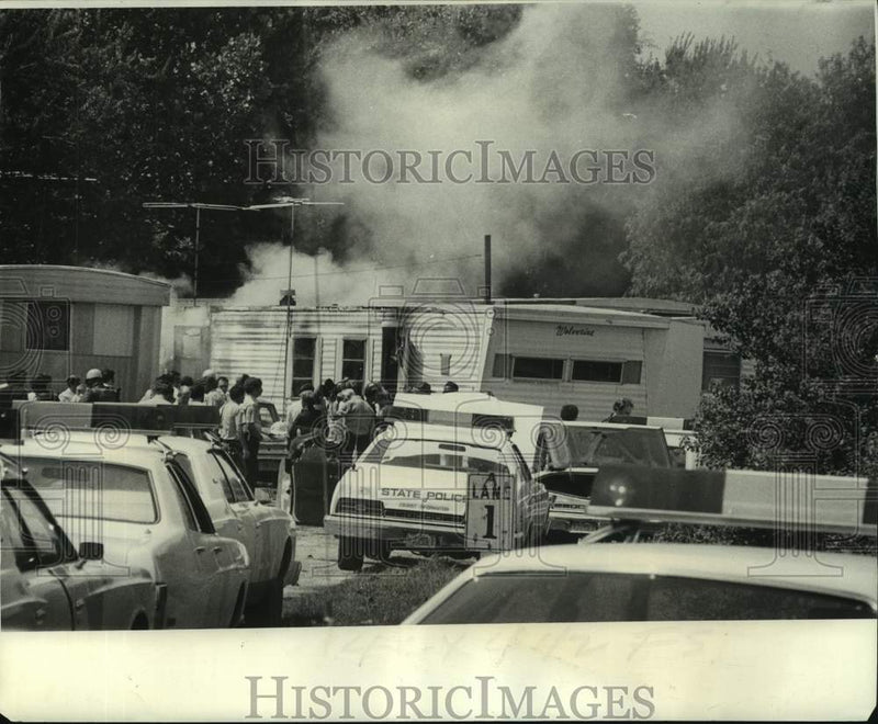 Load image into Gallery viewer, 1975 Press Photo Fire Caused by Police Tear Gas Canister Engulfs Mobile Home
