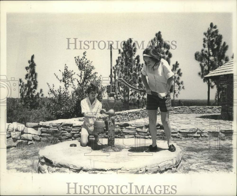 Load image into Gallery viewer, 1962 Press Photo Barbara and Anabel Moore fetch water at Kistachie Forest
