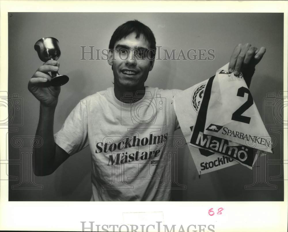 1989 Press Photo Keith Iovine with trophy &amp; running numbers from European events- Historic Images