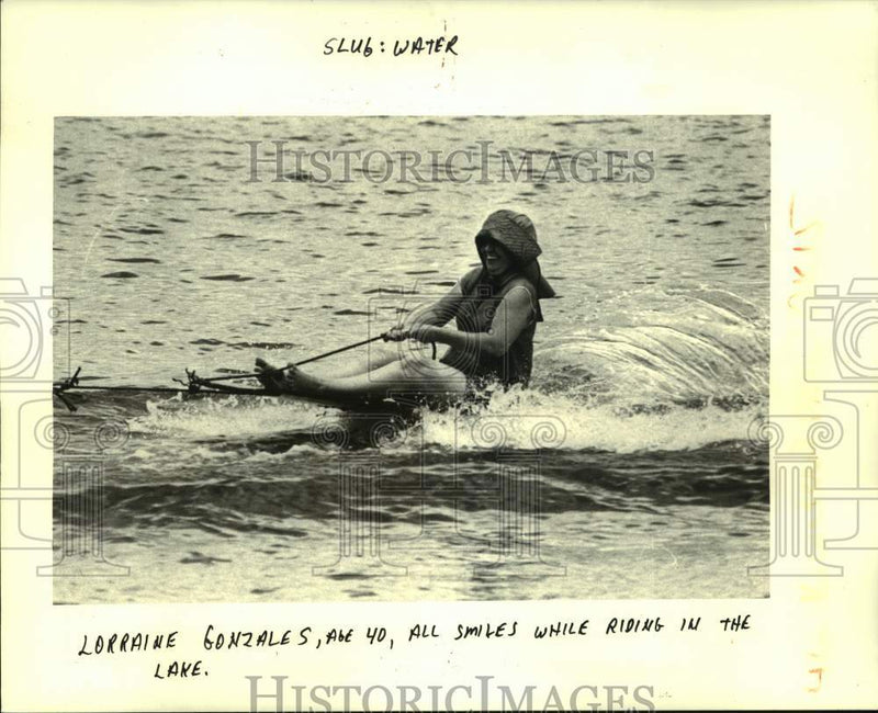 Load image into Gallery viewer, 1984 Press Photo Lorraine Gonzales being pulled on a makeshift surf board
