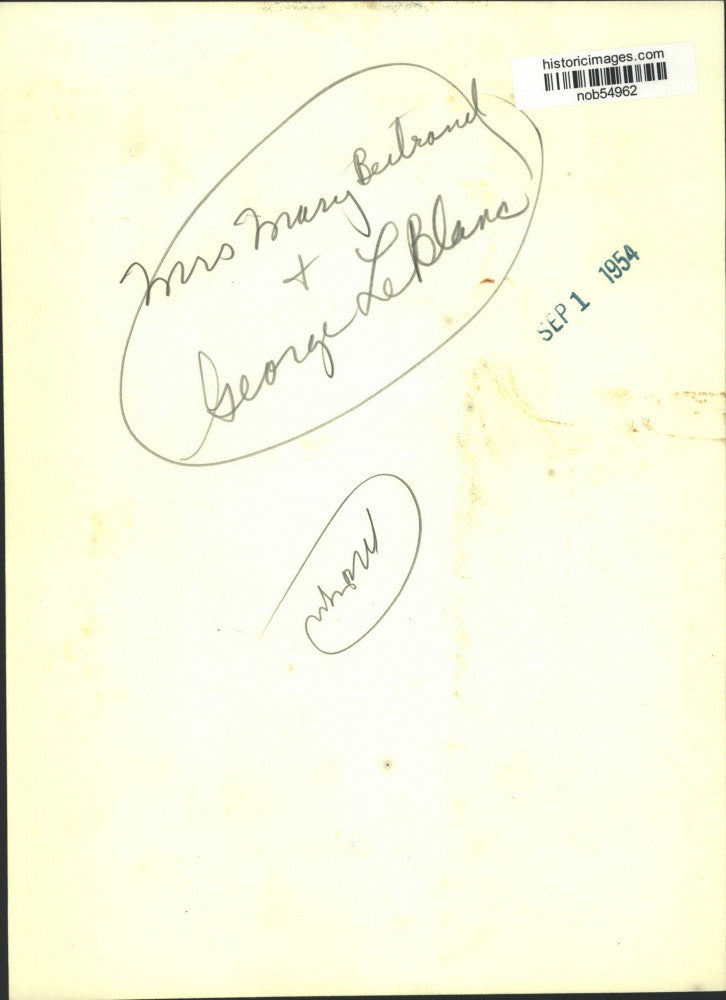 1954 Press Photo George LeBlanc Kisses Mrs. Mary Bertrand On The Cheek