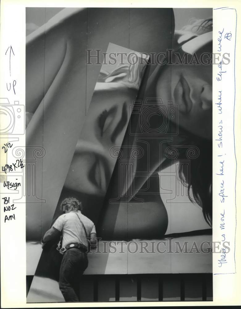 1991 Press Photo Dan Presley removes panel of a billboard, Metairie - nob59115- Historic Images