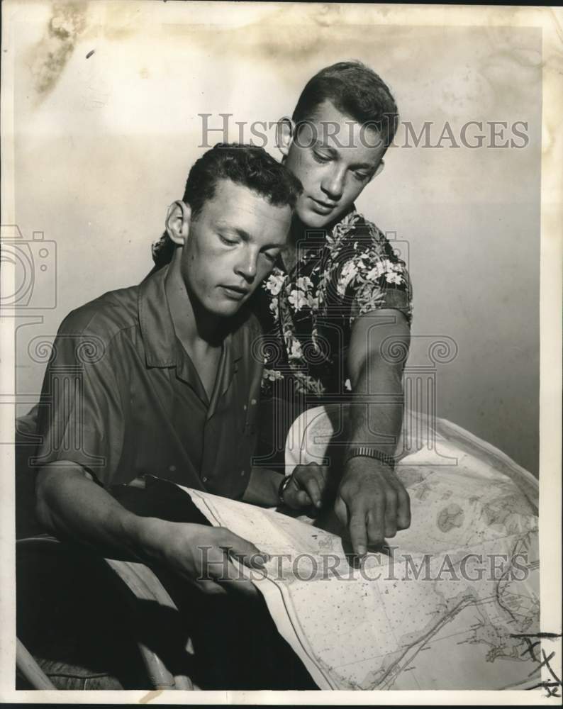 Load image into Gallery viewer, 1961 Press Photo Lowell Grieves &amp; Steven Pace review their 1286-mile boat trip
