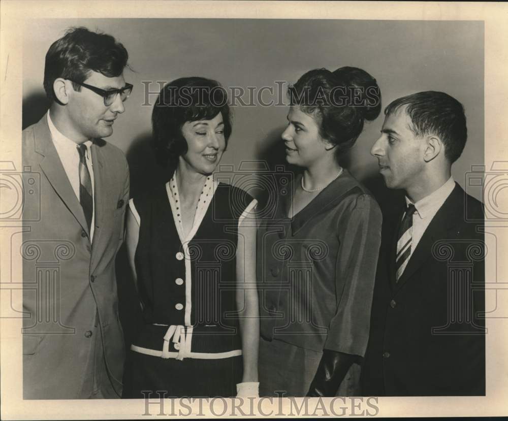 1965 Press Photo Valerie Oustalet and others discuss pageant schedules