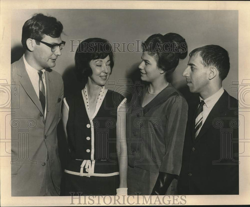 Load image into Gallery viewer, 1965 Press Photo Valerie Oustalet and others discuss pageant schedules
