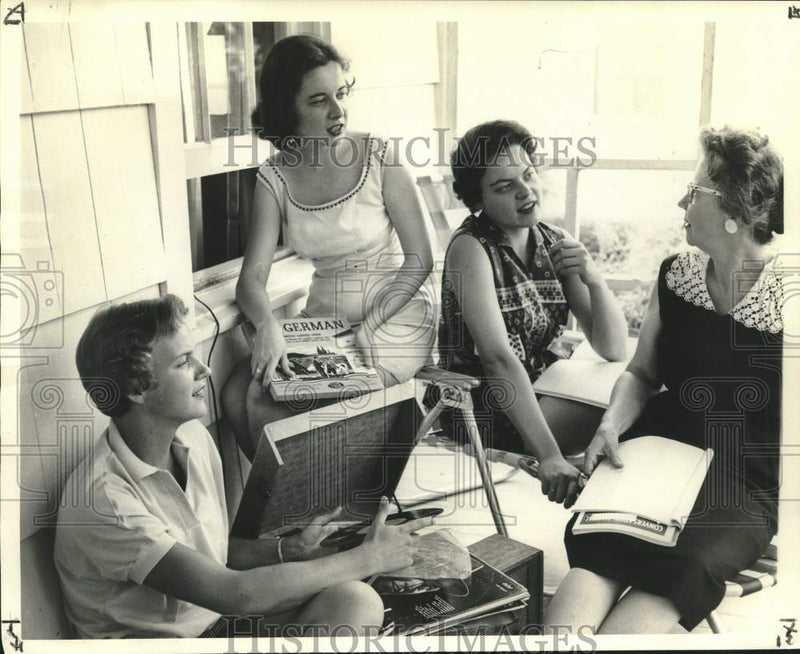 Load image into Gallery viewer, 1960 Press Photo Family helps Dannie learn German before study in Berlin
