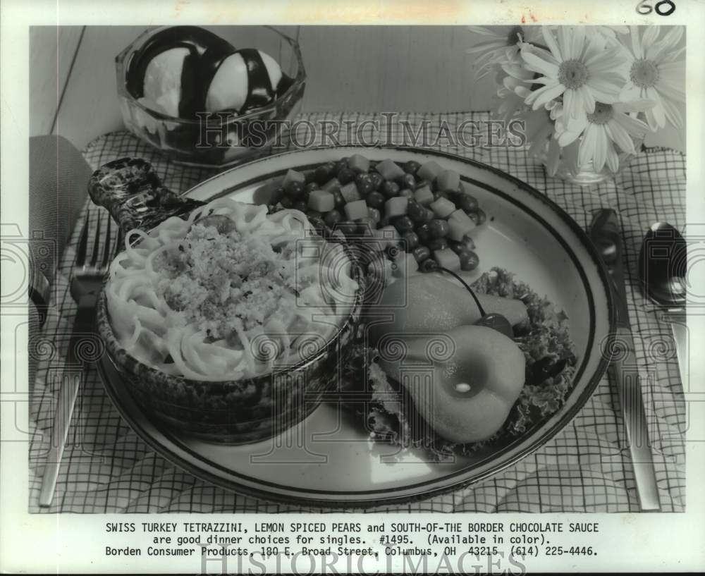 1982 Press Photo Swiss Turkey Tetrazzini, Lemon Spiced Pears &amp; Chocolate Sauce