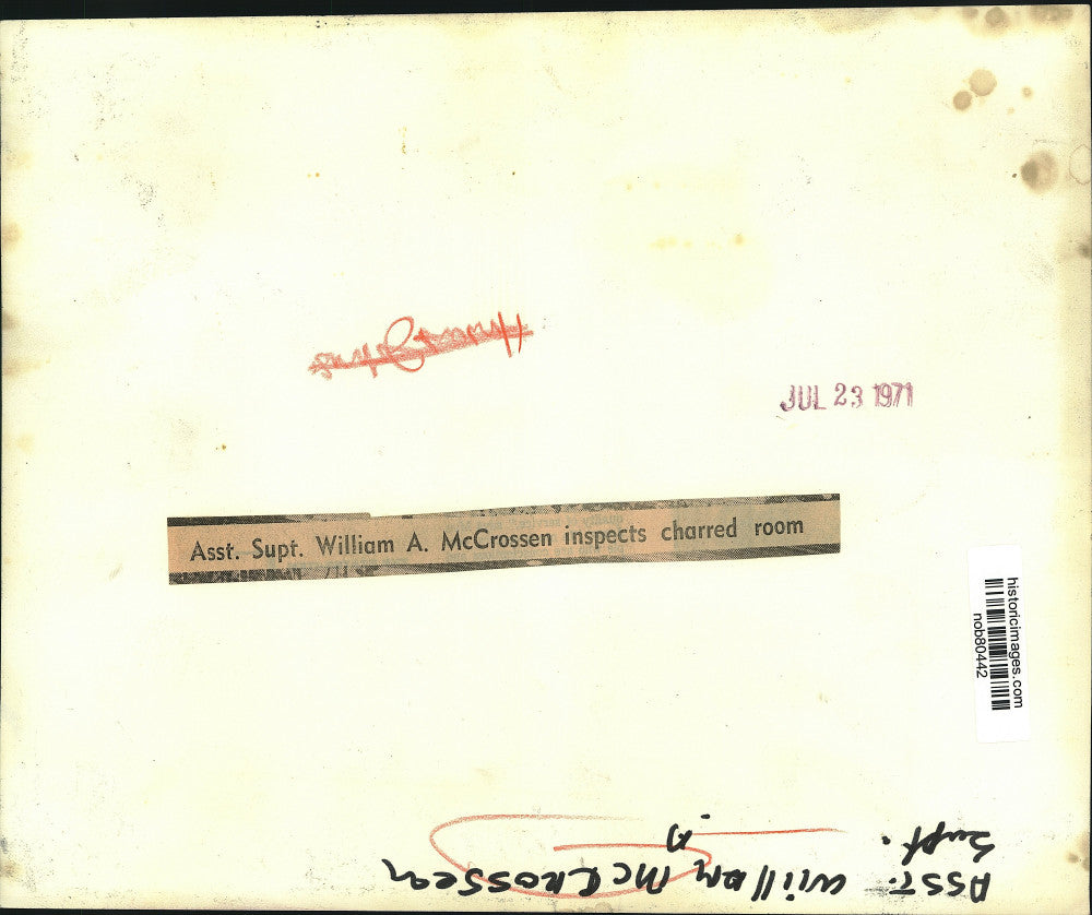 1971 Press Photo Asst. Superintendent William McCrossen inspects charred room