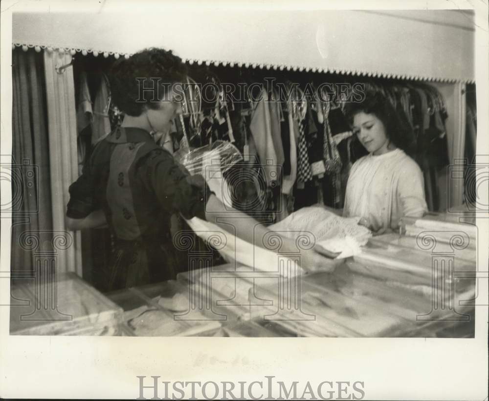 1960 Press Photo Salesgirl Shirley Pitre Helps Shopper Select Dress-Eunice Store- Historic Images