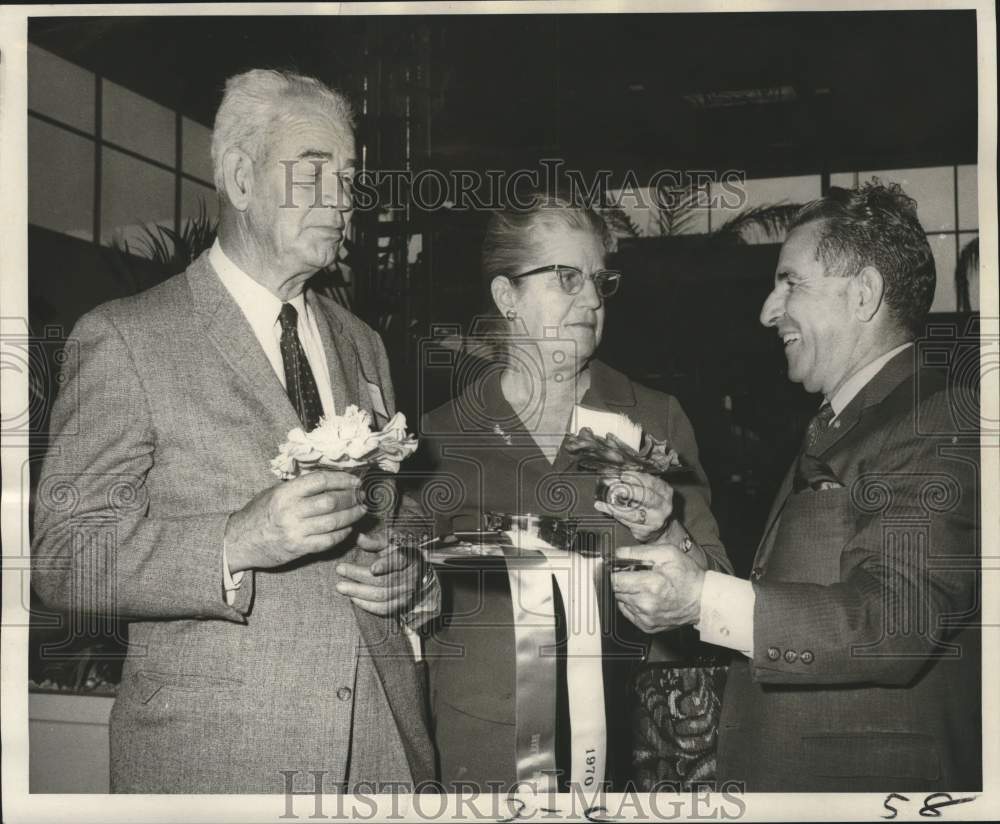 1970 Press Photo Receiving trophies at the 30th annual Camellia Show - nob83078- Historic Images