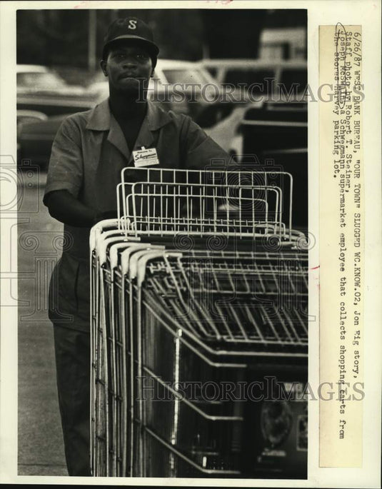 1987 Press Photo Schwegmann supermarket worker Joseph McSwain collects carts- Historic Images