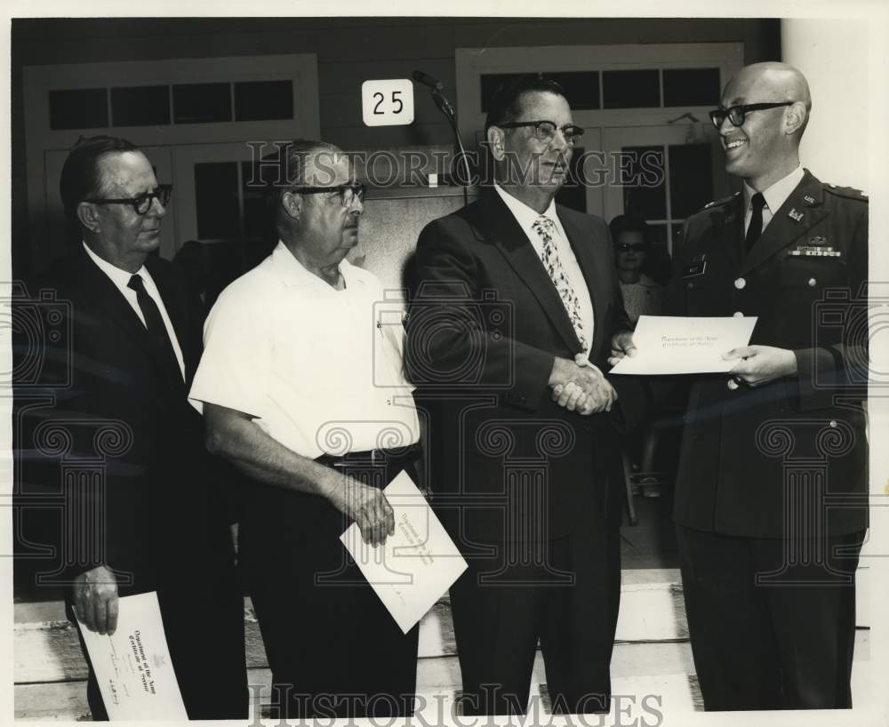 1970 Press Photo Major Steven West gives certificates to New Orleans employees- Historic Images