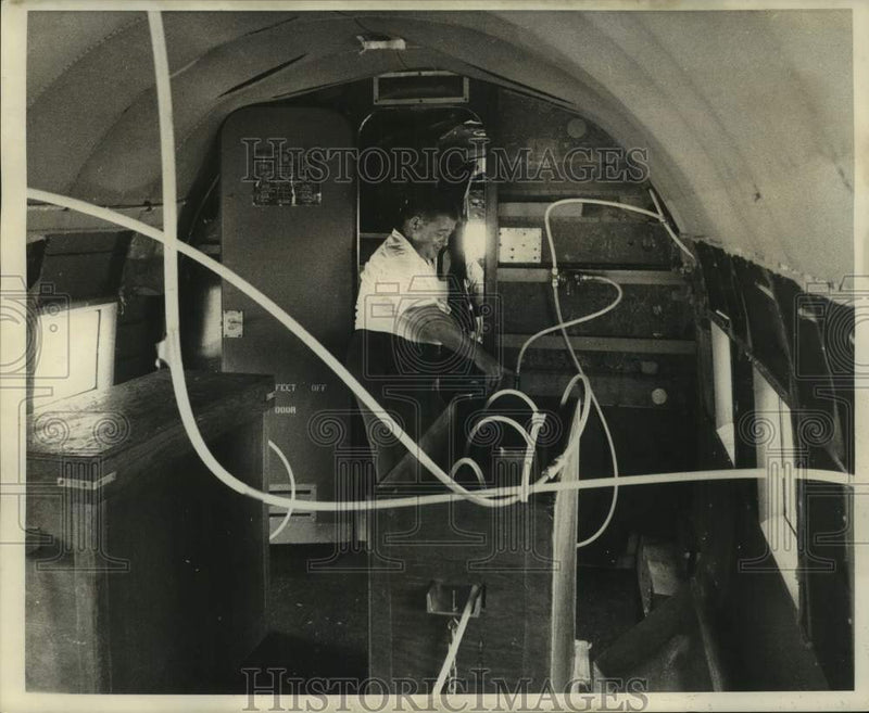 Load image into Gallery viewer, 1968 Press Photo J.C. Coste, maintenance repairman with mosquito control program
