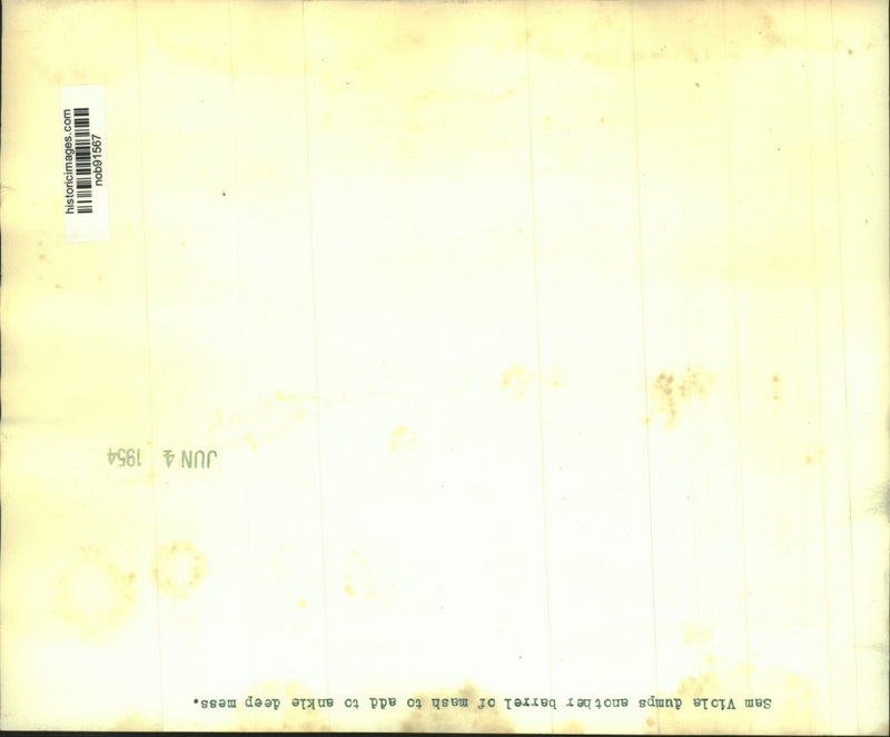 Load image into Gallery viewer, 1954 Press Photo Sam Viola dumps another barrel of mash to add ankle deep mess
