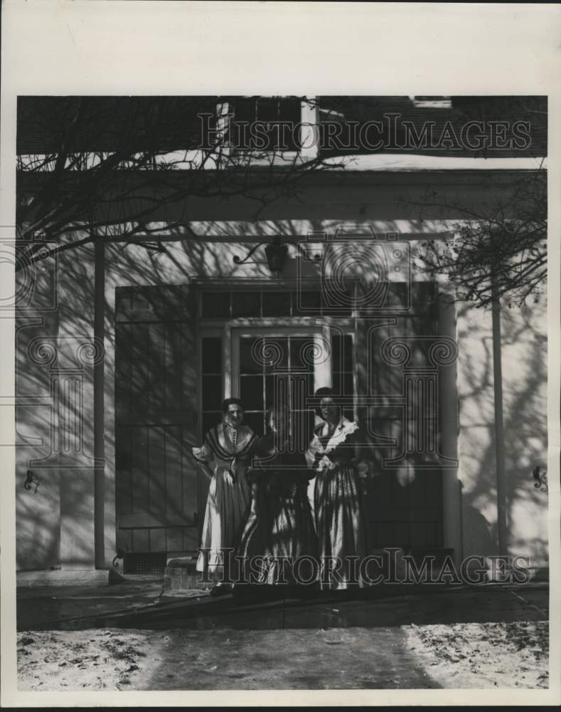 1963 Press Photo Women in calico from Nathictoches stand in front of Lemee house