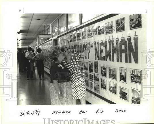 1994 Press Photo Alumni look at photos during Newman School 90th birthday event