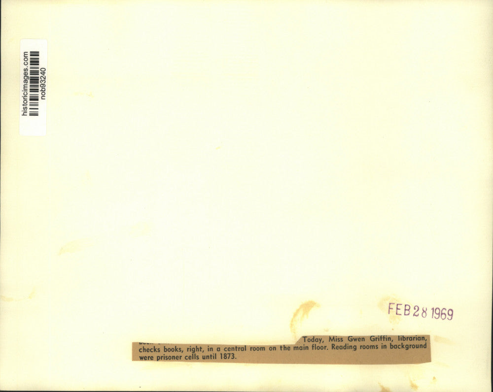 1963 Press Photo Miss Gwen Griffin Checks Books In Old Prison Turned Library