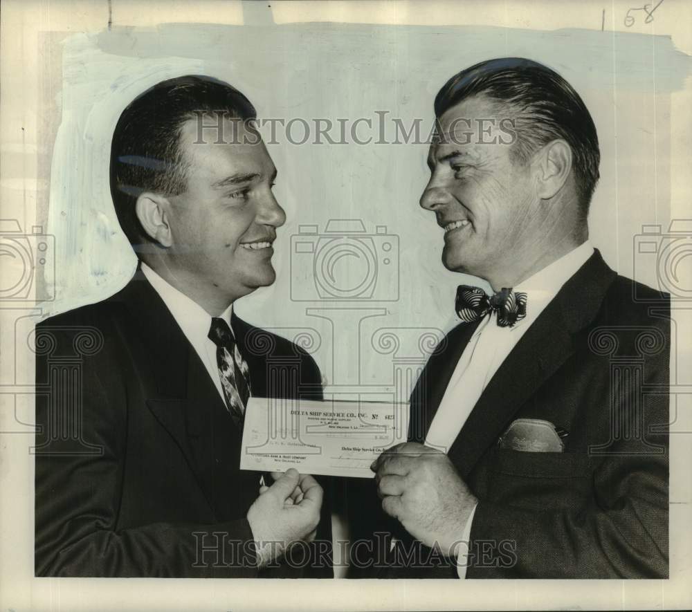 1952 Press Photo Fred Krass Jr. receives check from Andrew Meyer of Delta Ship- Historic Images