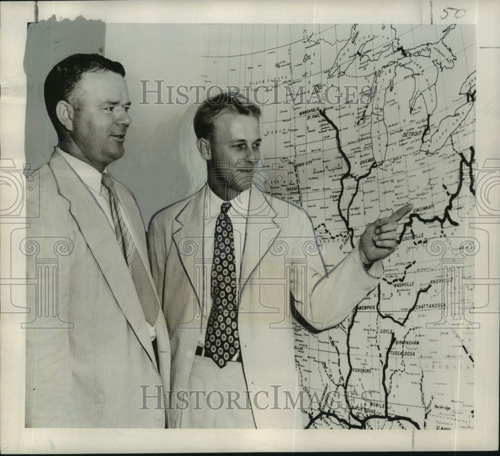1954 Press Photo Stanhope Hopkins points barge lines as E.T. Merrick looks on