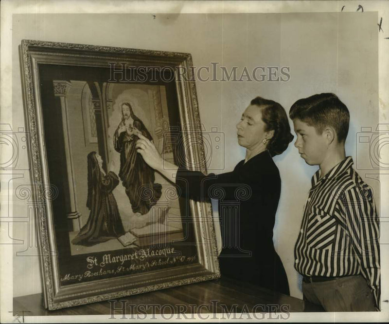 Load image into Gallery viewer, 1958 Press Photo Irma Messmer, Son Lloyd Inspect Religious Needlepoint Artwork
